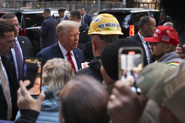 Former President Donald Trump speaks with construction workers at the construction site of the new JPMorgan Chase headquarters in midtown Manhattan, Thursday, April 25, 2024, in New York. Trump met with construction workers and union representatives hours before he's set to appear in court. (AP Photo/Yuki Iwamura)