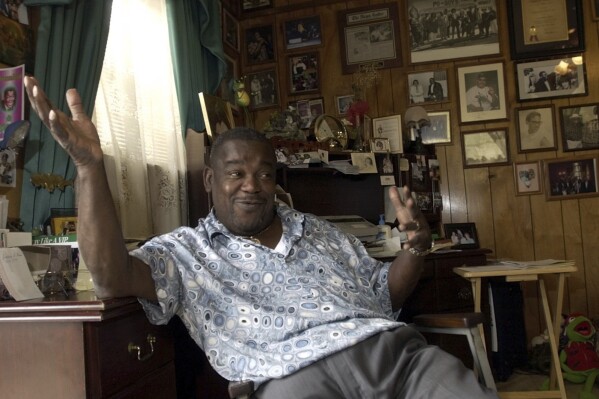 FILE - Clarence "Frogman" Henry gestures during an interview at his home in Algiers, La., June 12, 2003. Henry, one of New Orleans’ best known old-time R&B singers who scored a hit at age 19 with “Ain't Got No Home" in 1956, has died at age 87. (AP Photo/Bill Haber, File)