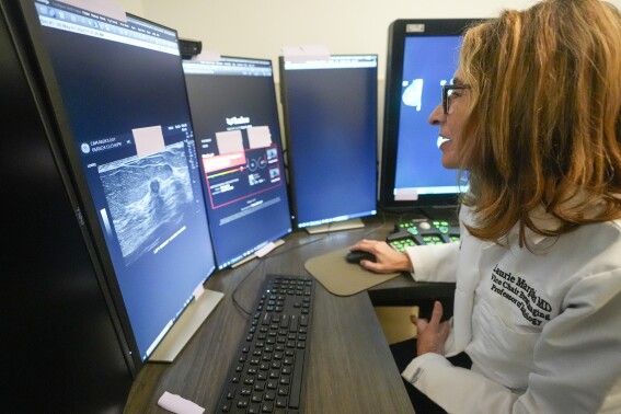 Dr. Laurie Margolies demonstrates the Koios DS Smart Ultrasound software, Wednesday, May 8, 2024, at Mount Sinai hospital in New York. The breast imaging AI is used to get a second opinion on mammography ultrasounds. “I will tell patients, ‘I looked at it, and the computer looked at it, and we both agree,’” Margolies said. “Hearing me say that we both agree, I think that gives the patient an even greater level of confidence.” (AP Photo/Mary Altaffer)