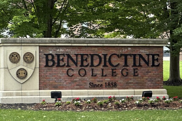 The Benedictine College sign is seen Wednesday, May 15, 2024, in Atchison, Kan., days after Kansas City Chiefs kicker Harrison Butker gave a commencement speech that has been gaining attention. Butker's speech has raised some eyebrows with his proclamations of conservative politics and Catholicism, but he received a standing ovation from graduates and other attendees of the commencement ceremony on Saturday, May 11. (AP Photo/Nick Ingram)