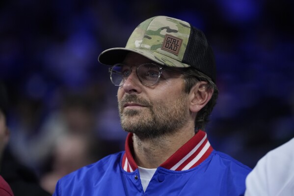 Actor Bradley Cooper watches warmsups ahead of Game 6 in an NBA basketball first-round playoff series between the Philadelphia 76ers and the New York Knicks, Thursday, May 2, 2024, in Philadelphia. (AP Photo/Matt Slocum)