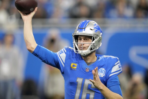 FILE - Detroit Lions quarterback Jared Goff passes against the Tampa Bay Buccaneers during the first half of an NFL football NFC divisional playoff game, Sunday, Jan. 21, 2024, in Detroit. A person familiar with the situation says the Lions and Goff have agreed to a $212 million, four-year contract extension. The person tells The Associated Press, Monday, May 13, 2024, that the deal includes $170 million in guarantees, speaking on condition of anonymity because the terms were not announced. (AP Photo/Carlos Osorio, File)