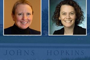 Headshots of two researchers, Laura Hopson (L) and Linda Regan (R). The background is an opaque version of the Hopkins logo.