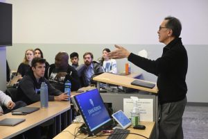 Johns Hopkins professor Fadil Santosa speaks to students in his “Mathematics for a Better World” course