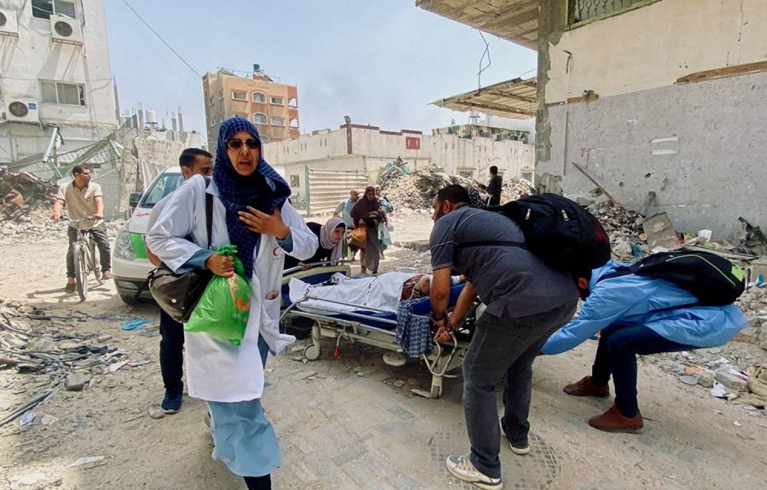 Palestinians evacuate Kamal Adwan hospital following an Israeli strike, amid the ongoing conflict between Israel and the Palestinian group Hamas, in Beit Lahia in the northern Gaza Strip, May 21, 2024. (Reuters)