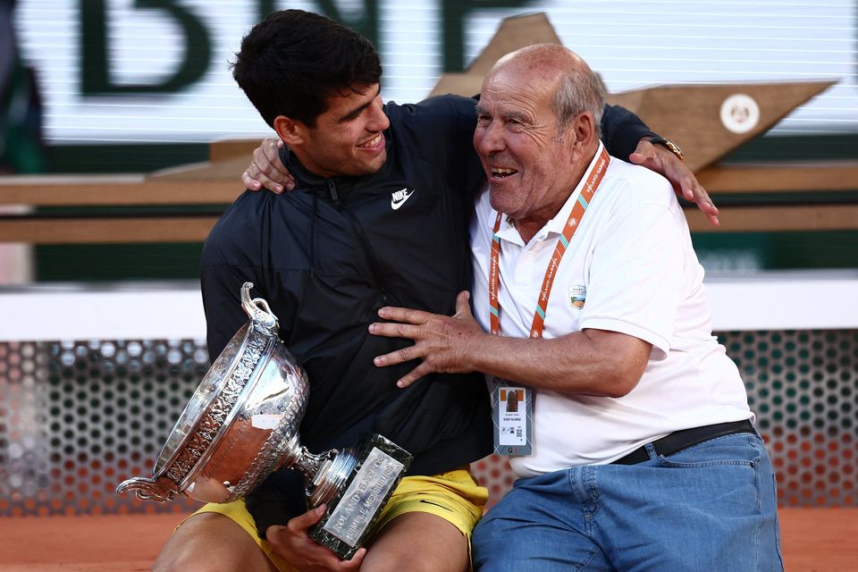 Spain's Carlos Alcaraz celebrates with his grandfather after winning the French Open men's singles final against Germany's Alexander Zverev yesterday.