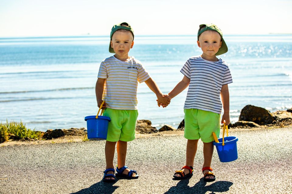 Brothers, Maks and Mark Holubiev (2) from Urkraine on their way to Sandymount beach during the heatwave. Pic:Mark Condren 12.8.2022