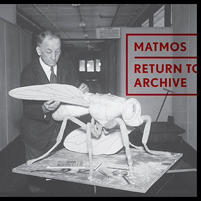 Album cover with black-and-white photo of man inspecting a model wasp.