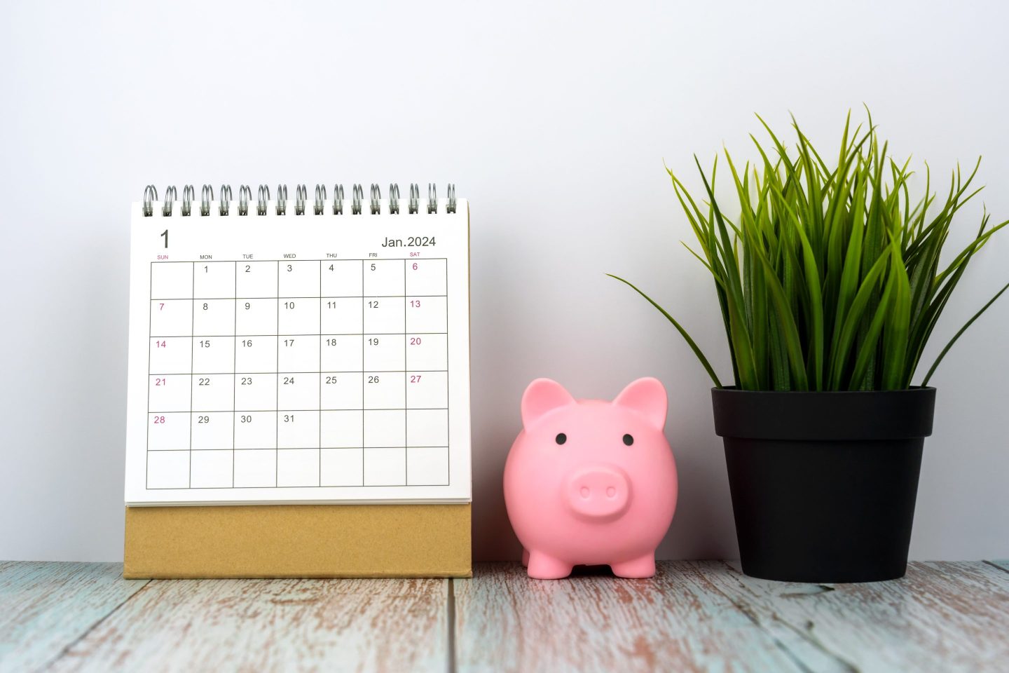 January 2024 Desk Calendar With Piggy Bank and Potted Plant
