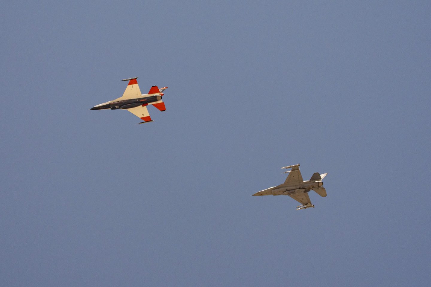 two F-16s fly next to each other