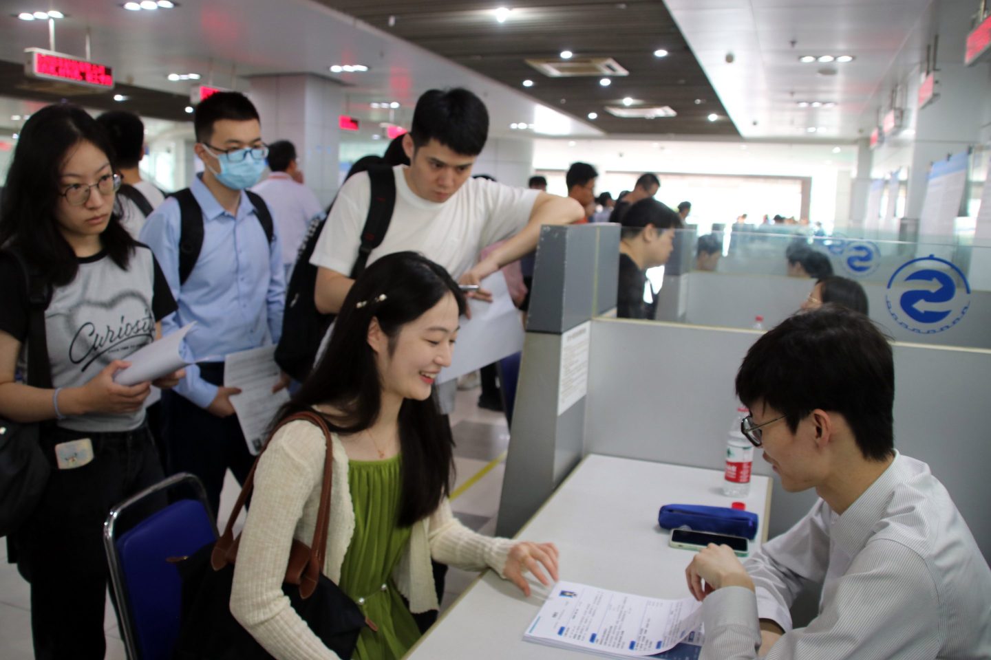 Job seekers look for positions at the 2023 Summer college Graduates Employment and Internship Fair in Suqian, Jiangsu Province, China, Aug. 9, 2023. (Photo by Costfoto/NurPhoto via Getty Images)