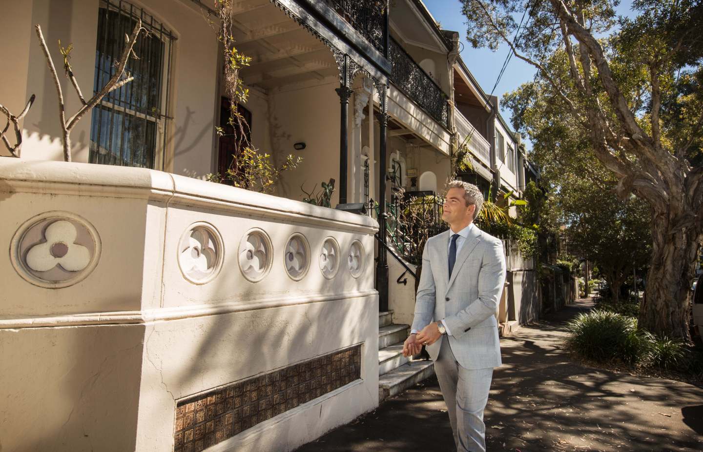 Ryan Serhant poses outside a luxury condo.