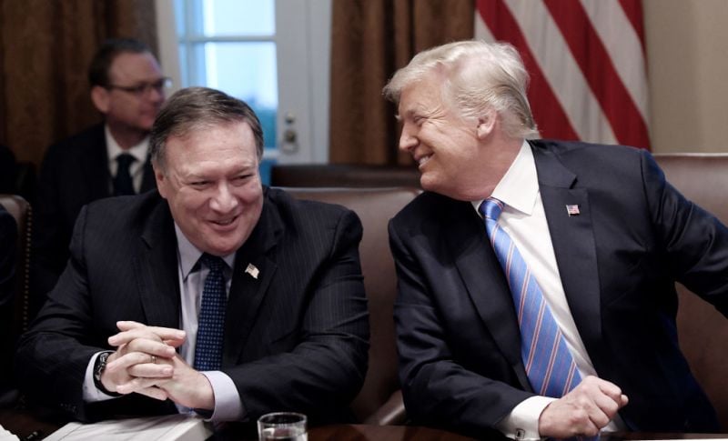 Secretary of State Mike Pompeo and President Trump share a laugh during a cabinet meeting with U.S. President Donald Trump in the Cabinet Room of the White House, July 18, 2018 in Washington.