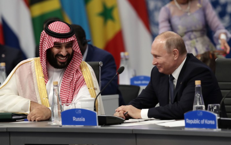 Saudi Arabia's Crown Prince Mohammed bin Salman and Russia's President Vladimir Putin sit together attend the G20 Leaders' Summit in Buenos Aires, on November 30, 2018.