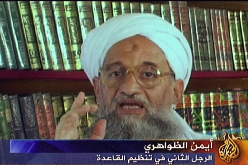 A screen grab shows Zawahiri speaking above a chyron in Arabic with his name and position in al Qaeda.