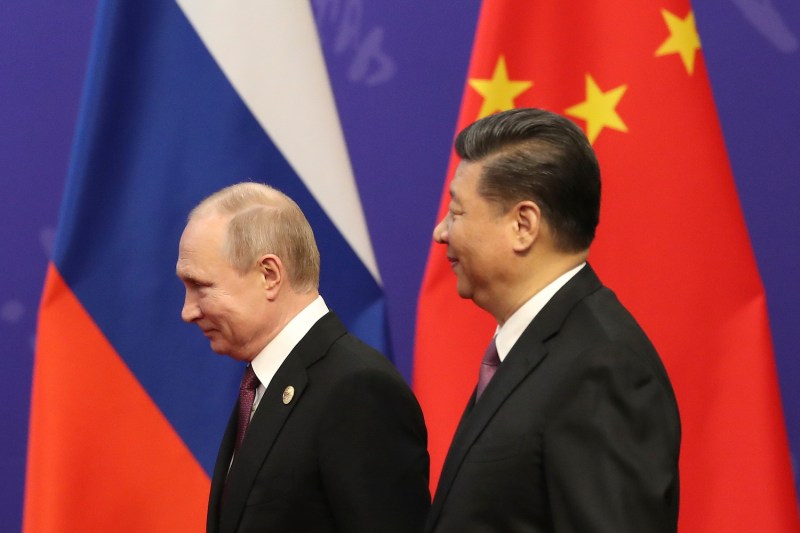 Russian President Vladimir Putin, left, and Chinese President Xi Jinping attend an event at Tsinghua University in Beijing on April 26, 2019.