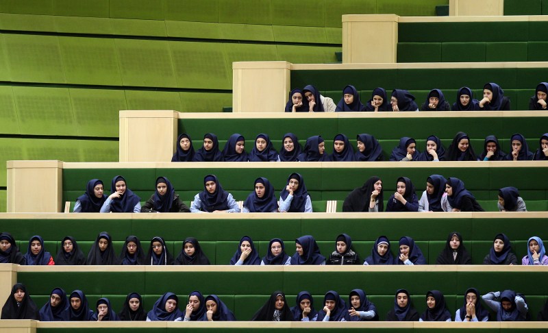 Iranian students attend a parliament session in Tehran on November 15, 2009.