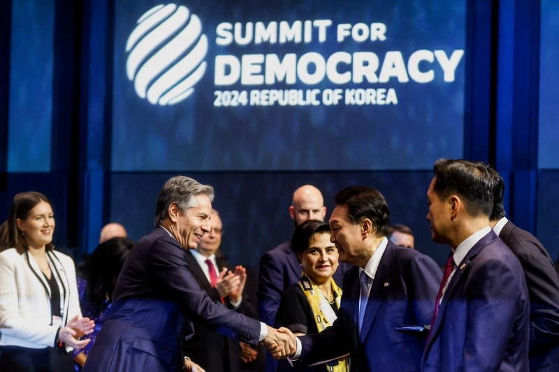 U.S. Secretary of State Antony Blinken shakes hands with South Korean President Yoon Suk-yeol during the third Summit for Democracy in Seoul on March 18.