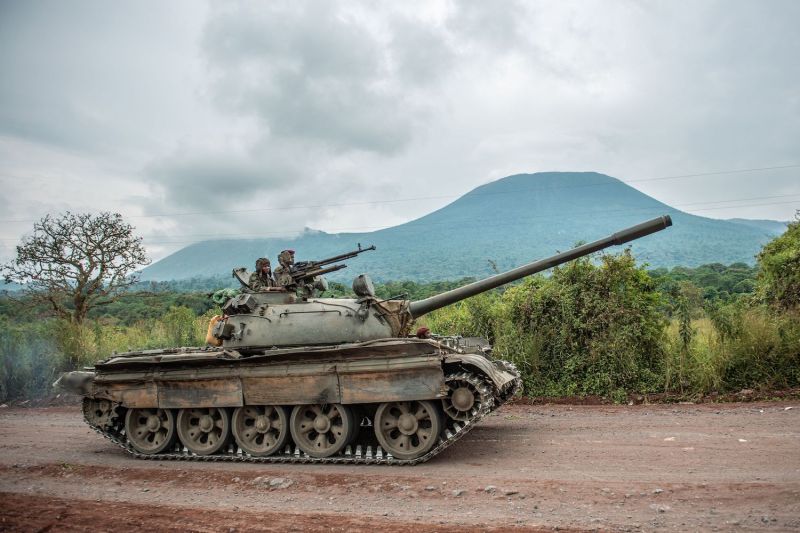 A Congolese army tank heads towards the front line near Kibumba in the area surrounding the North Kivu city of Goma on May 25, 2022 during clashes between the Congolese army and M23 rebels.