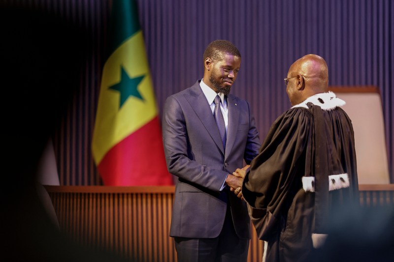 Bassirou Diomaye Faye (L) is sworn in as Senegal's president at an exhibition centre in the new town of Diamniadio near the capital Dakar on April 2.