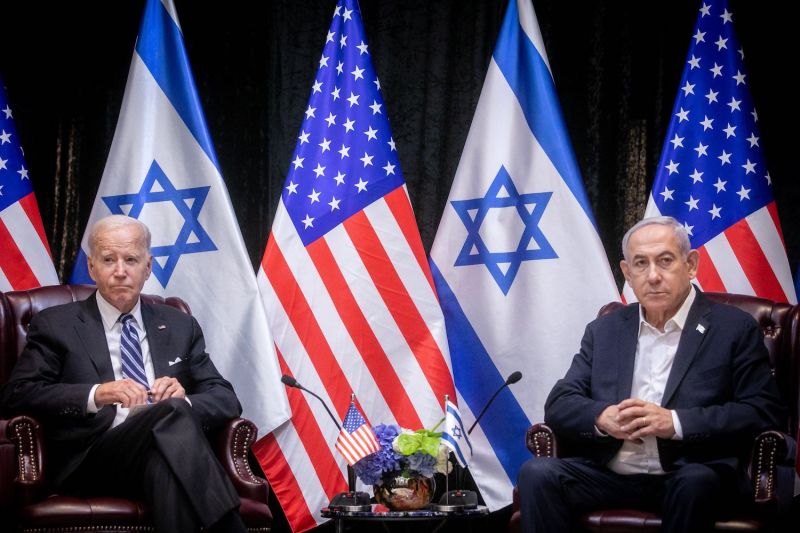 U.S. President Joe Biden sits with Israeli Prime Minister Benjamin Netanyahu at the start of the Israeli war cabinet meeting in Tel Aviv on Oct. 18, 2023.