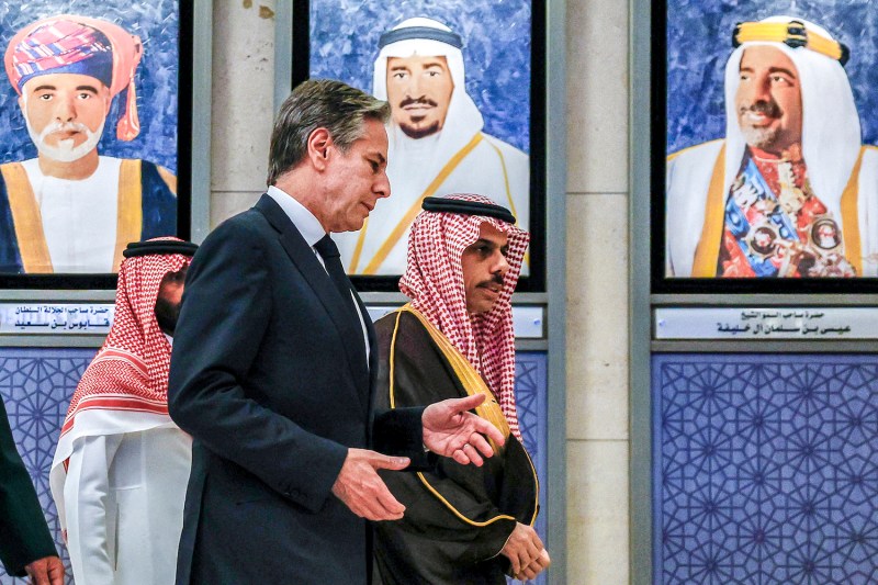 U.S. Secretary of State Antony Blinken speaks with Saudi Foreign Minister Prince Faisal bin Farhan Al Saud as they walk past portraits of the founding leaders of the Gulf Cooperation Council at the council’s secretariat in Riyadh, Saudi Arabia, on April 29.