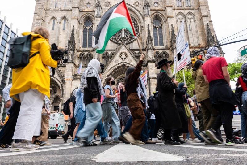 Pro-Palestinian protesters walk from Columbia University down to Hunter College as protests at area universities and colleges continue on May 6, in New York City.