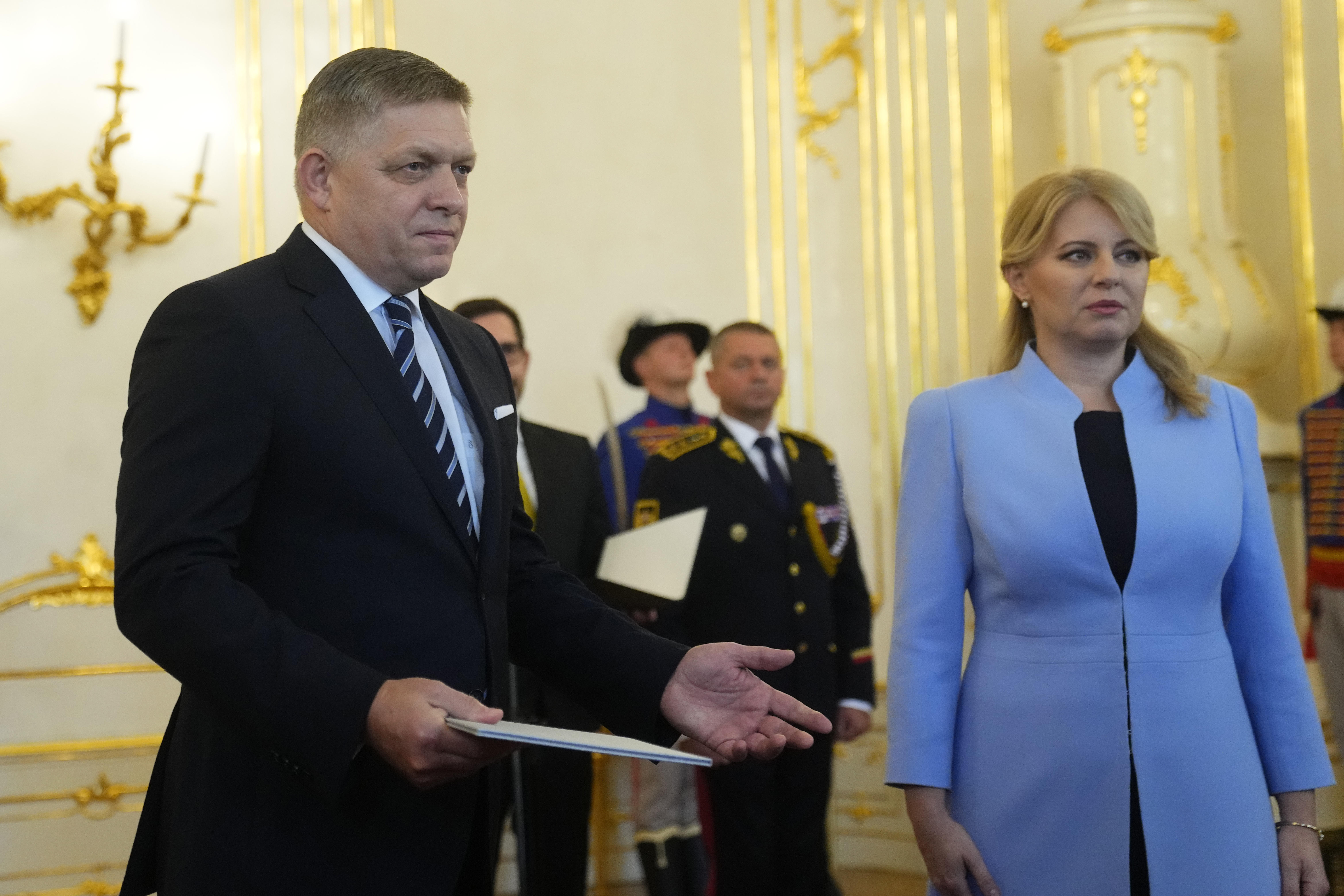 FILE - Slovakia's President Zuzana Caputova, right, and newly appointed Prime Minister Robert Fico pose for a photo during a swear in ceremony at the Presidential Palace in Bratislava, Slovakia, Wednesday, Oct. 25, 2023. Prime Minister Robert Fico returned to power in Slovakia last year. Having previously served twice as prime minister, from 2006 to 2010 and again from 2012 to 2018, the 59-year-old's third term made him the longest-serving head of government in Slovakia’s history. (AP Photo/Petr David Josek, File)