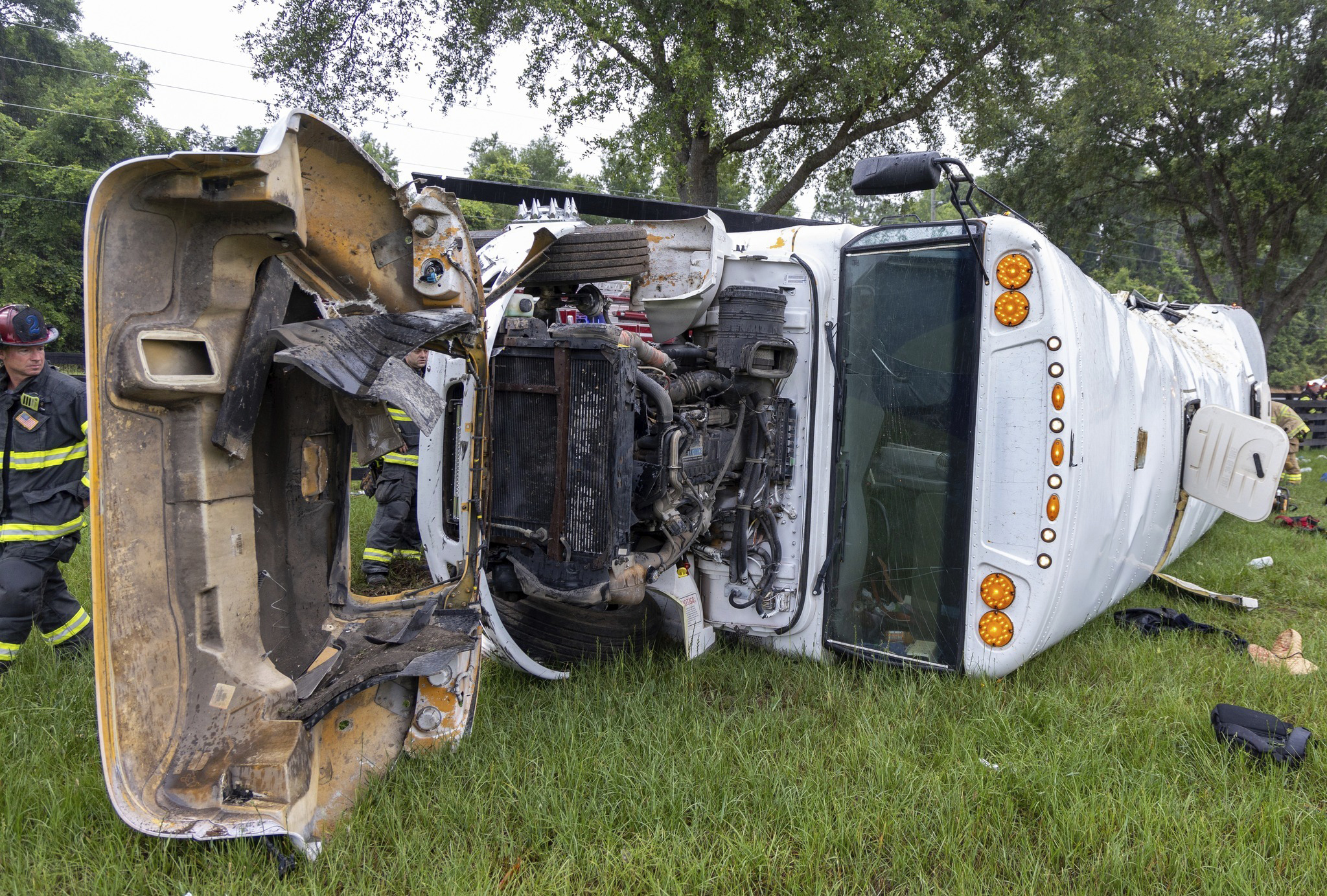 This photo provided by the Marion County Fire Rescue Dept. shows a bus carrying 53 farmworkers that crashed and overturned early Tuesday, May 14, 2024 near Ocala, Fla. which is north of Orlando. (Marion County Fire Rescue Dept. via AP)