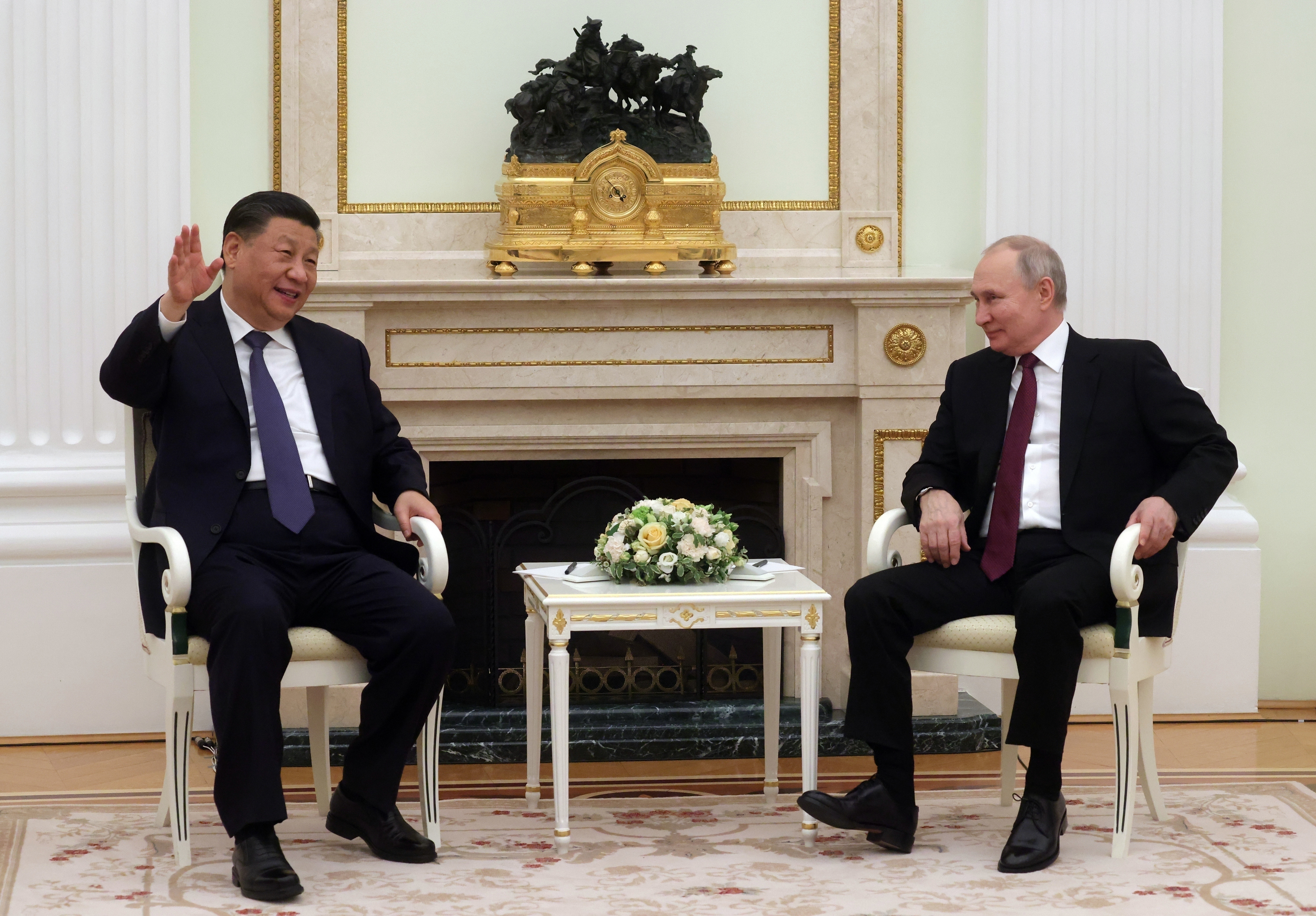 FILE - Chinese President Xi Jinping, left, gestures while speaking to Russian President Vladimir Putin during a meeting at the Kremlin in Moscow, Russia on March 20, 2023. Putin is traveling to China on Thursday on his first foreign trip as he starts his fifth term, a visit that underlines an increasingly close partnership. (Sergei Karpukhin, Sputnik, Kremlin Pool Photo via AP, File)