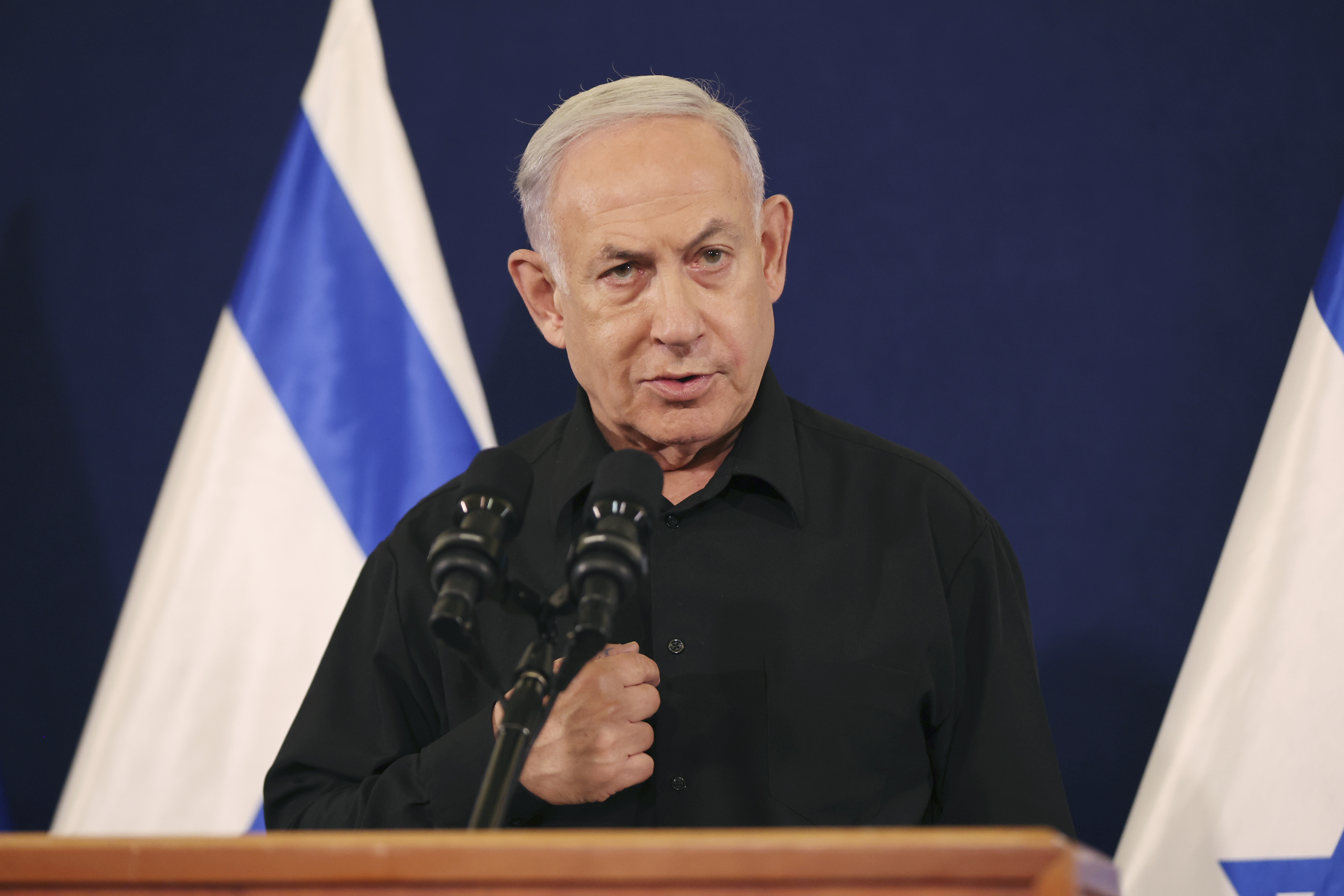 FILE - Israeli Prime Minister Benjamin Netanyahu speaks during a news conference in the Kirya military base in Tel Aviv, Israel, on Oct. 28, 2023. The departure of Benny Gantz, a centrist member of Israel's three-member War Cabinet, after eight months spent in Israel's war cabinet does not immediately appear to challenge government but does put pressure on Netanyahu. His resignation will likely embolden and empower Israel's radical ultranationalist cabinet ministers who have fiercely opposed all cease-fire deals. (Abir Sultan/Pool Photo via AP, File)