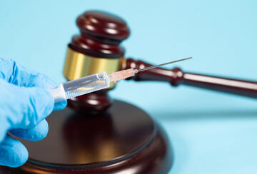 Illustration of COVID vaccine and judge's gavel