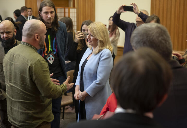 President Zuzana Čaputová of the Slovak Republic shakes hands with a group of Ukrainians following an event at the Freeman Spogli Institute for International Studies at Stanford University.