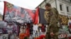 People visit a makeshift memorial for Wagner private mercenary group chief Yevgeny Prigozhin in central Moscow on October 1.