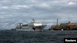 FILE - Chinese navy hospital-ship "Peace Ark" passes by the lighthouse of the colonial fortress Morro Cabana as it enters Havana Harbor.