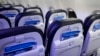 FILE - Safety cards in seat backs are seen on an Alaska Airlines Boeing 737 Max 9 aircraft at Seattle-Tacoma International Airport Jan. 10, 2024. The Justice Department says Boeing violated a settlement that let the company avoid criminal prosecution after two deadly crashes. 