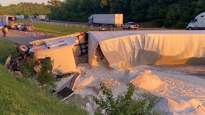 A tractor-trailer carrying flour overturned on Interstate 40 following a crash involving a...