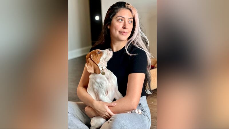 FILE -- Kristie Pereira and her dog Beau pose for a photo in Laurel, Md., in January 2023.