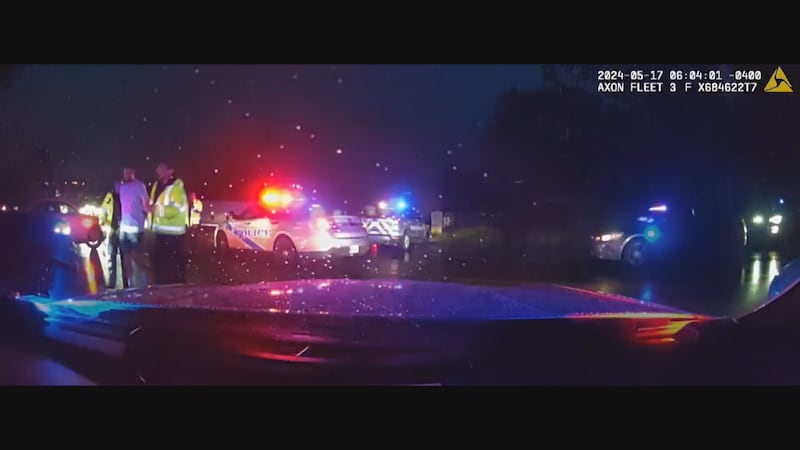 Dash cam footage from a police car that shows arrest of pro golfer Scottie Scheffler