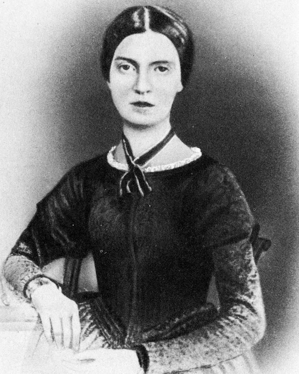 a black and white portrait photo showing emily dickinson