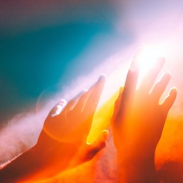 human hands stretched out to the burning sun, ethereal and unreal concepts of universe, spiritual and natural powers otherwise, fires burning down the past life, natural disaster, climate change and global warming, inferno, hell and chaos ultimate conceptual shot