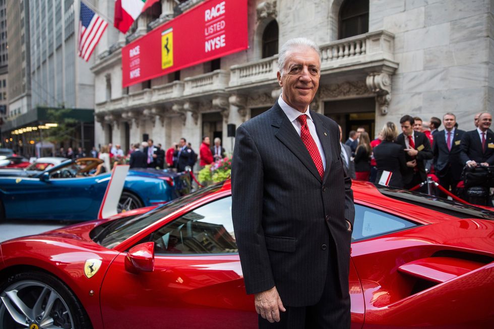 piero ferrari standing in front of a company car for a photo