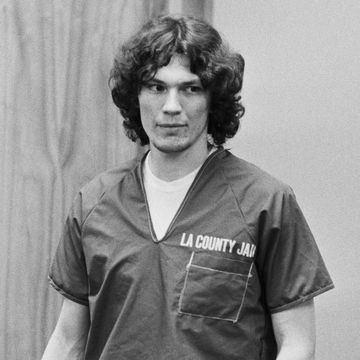 richard ramirez holding a binder while standing in a courtroom