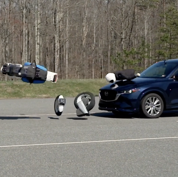 mazda crossover hits motorcycle crash test dummy in test