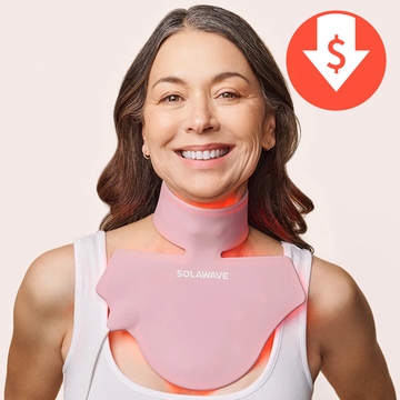 a woman wearing a solawave red light therapy neck and chest mask