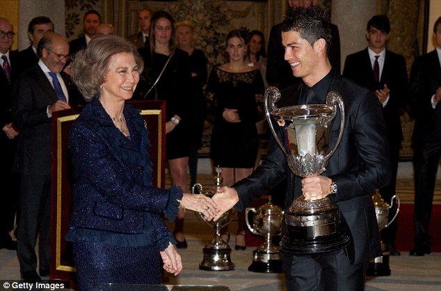 Royal approval: Queen Sofia of Spain presents Cristiano Ronaldo with the Ibero-American Community Trophy