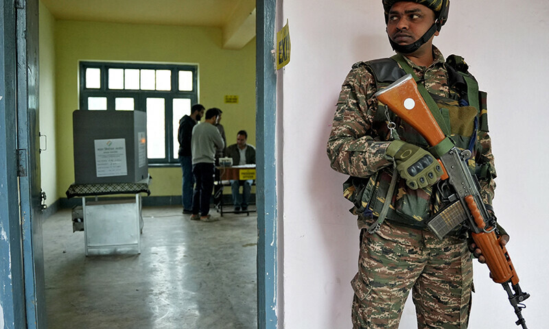  An Indian security force personnel stands guard outside a polling booth during the fourth phase of India’s general election in Srinagar on May 13. — Reuters 