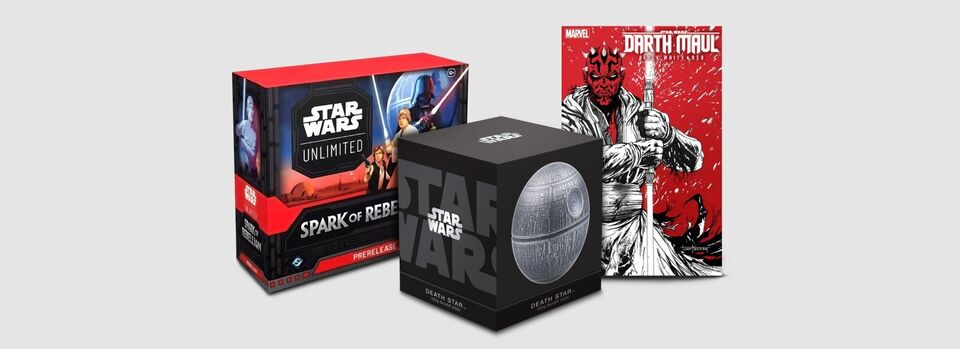 A Star Wars Unlimited Spark of Rebellion prerelease box, a Star Wars Death Star 2024 300g silver coin in its box, and a Star Wars Darth Maul Black, White, and Red graphic novel on a white background.