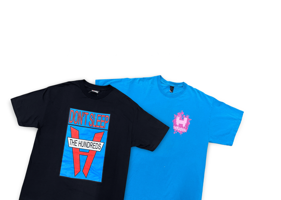 A black The Hundreds Venture t-shirt, with a blue and red logo in the centre, on top of a blue The Hundreds Kirby t-shirt against a red background. The Direct from The Hundreds checkmark sits above the products.