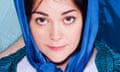 Head shot of actor Sarah Greene in blue head shawl, recreating playing the Virgin Mary in a nativity play